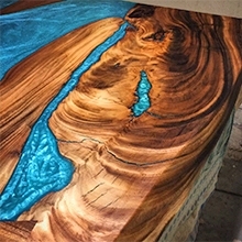 Epoxy river table created with TotalBoat High Performance 2:1 Epoxy mixed with Black Diamond pigment