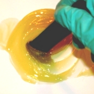 WEST SYSTEM G/flex 655 Thickened Epoxy Adhesive being stirred.